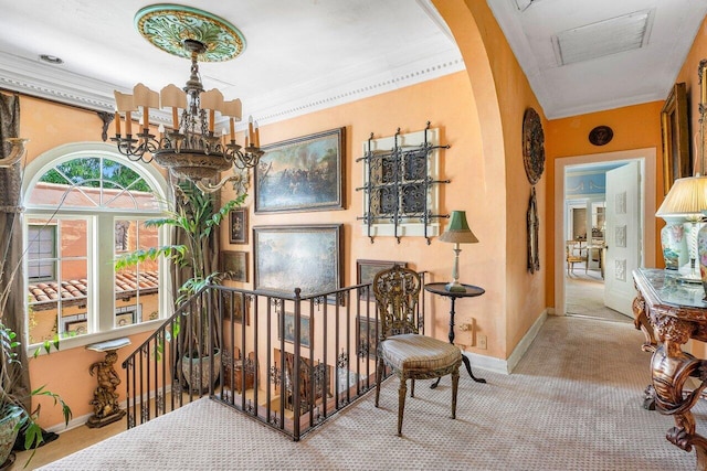 interior space with a notable chandelier and crown molding