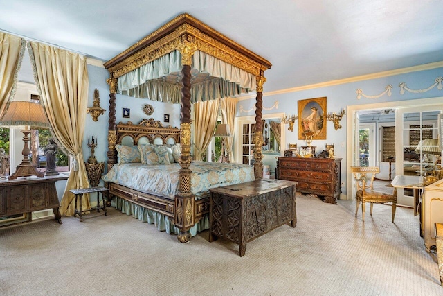 carpeted bedroom featuring crown molding and multiple windows