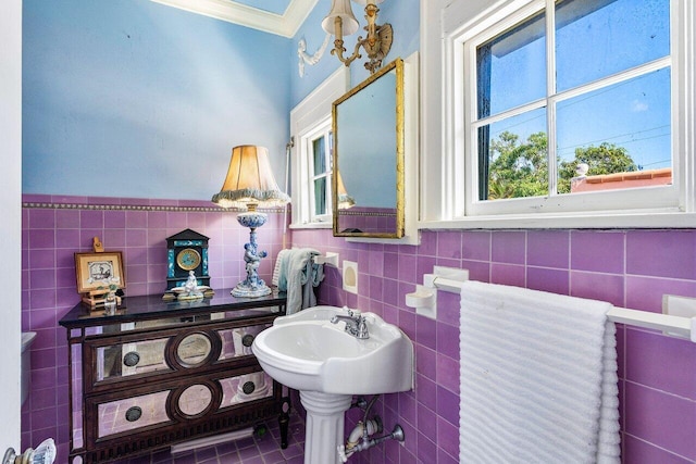 bathroom with tile walls and tile patterned floors