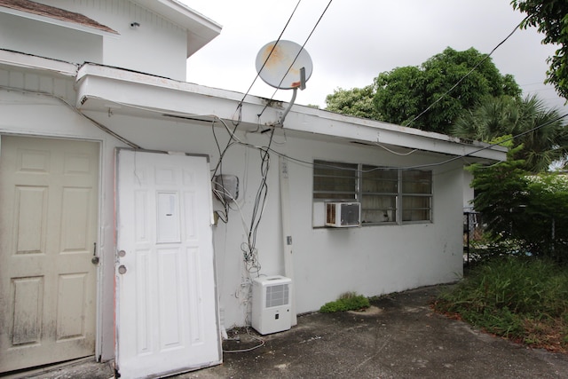 view of side of home with cooling unit