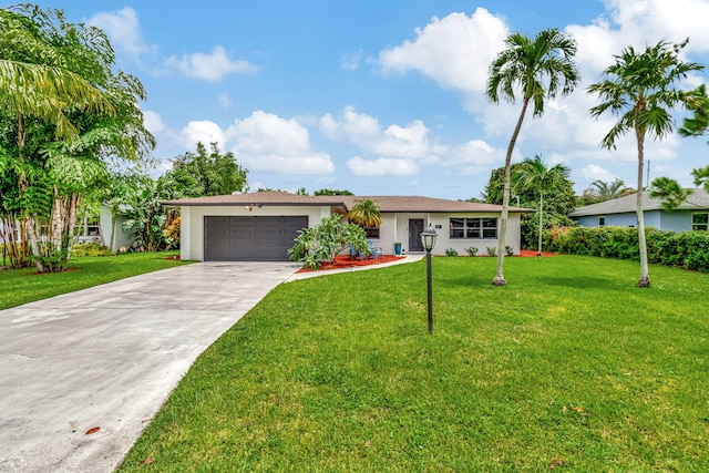 ranch-style house with a front lawn and a garage