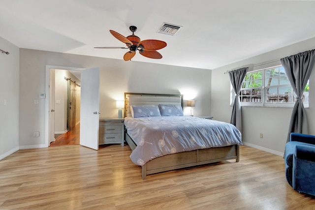 bedroom featuring light hardwood / wood-style flooring and ceiling fan