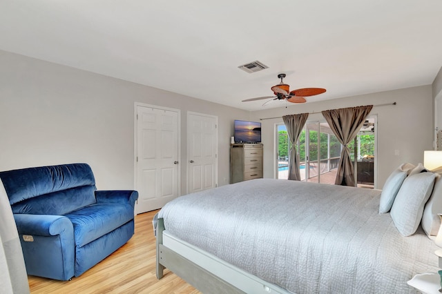 bedroom with access to exterior, wood-type flooring, and ceiling fan