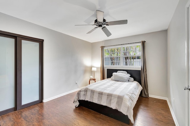 bedroom featuring ceiling fan and dark hardwood / wood-style floors