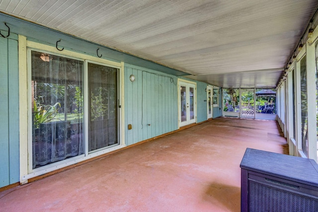 unfurnished sunroom with a healthy amount of sunlight