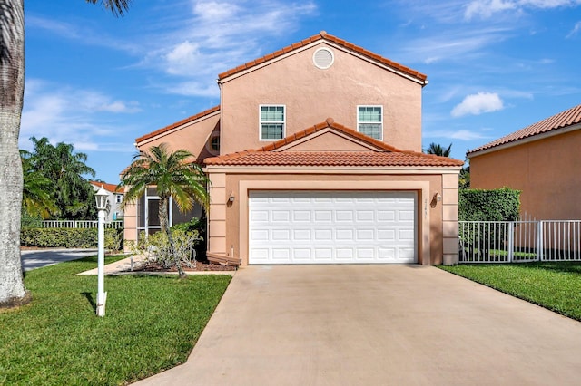 mediterranean / spanish-style house featuring a garage and a front lawn