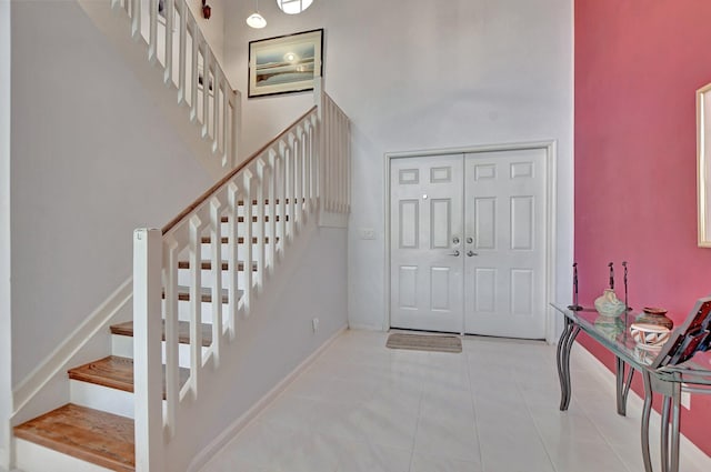 entryway with light tile patterned floors