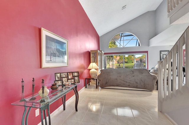 foyer with high vaulted ceiling