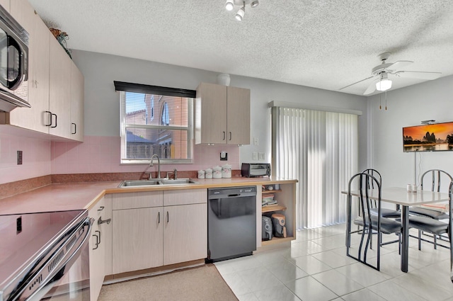 kitchen featuring tasteful backsplash, ceiling fan, sink, dishwasher, and stainless steel microwave