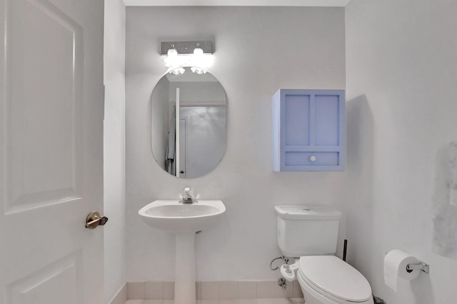 bathroom with tile patterned floors and toilet