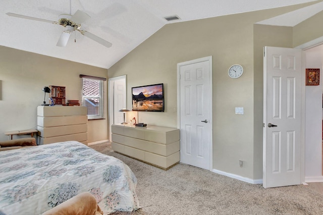 bedroom featuring ceiling fan, light carpet, and vaulted ceiling