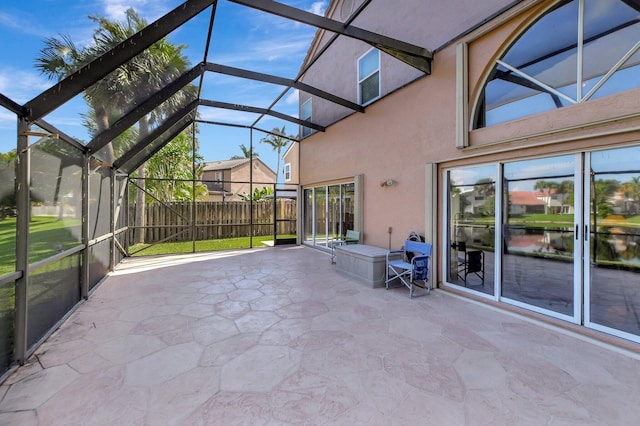 unfurnished sunroom featuring a water view and vaulted ceiling