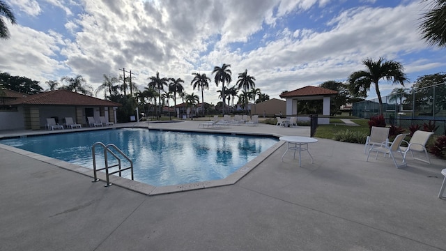 view of swimming pool featuring a gazebo and a patio area