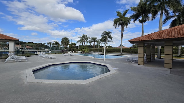 view of swimming pool featuring a gazebo and a patio area