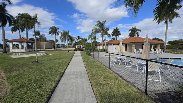 view of home's community with a gazebo, a yard, and a swimming pool