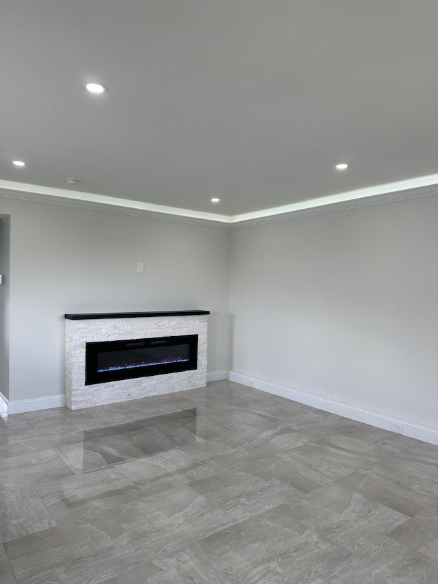 unfurnished living room featuring a fireplace