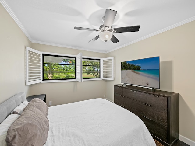 bedroom featuring ceiling fan and ornamental molding