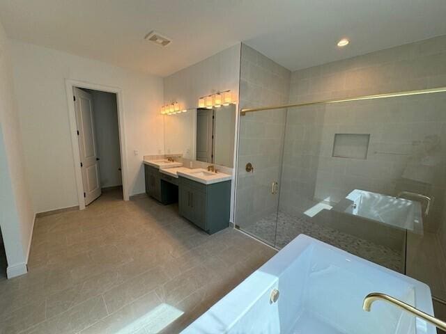 bathroom featuring vanity and separate shower and tub