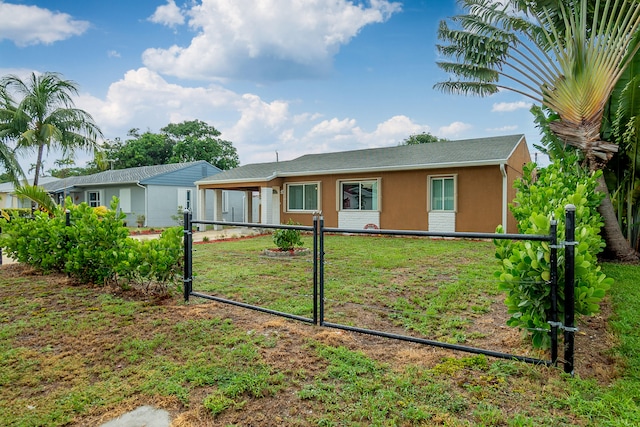 single story home with a front yard