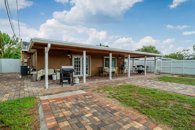 back of house featuring ceiling fan and a patio area