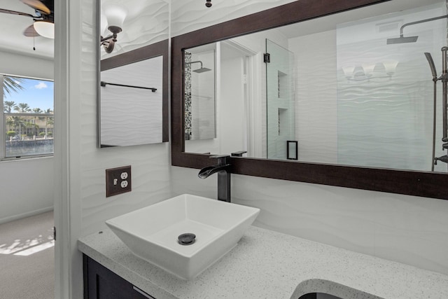 bathroom with ceiling fan and vanity