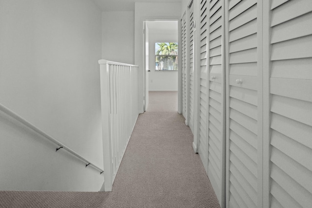 corridor with carpet flooring