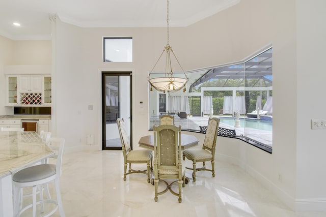 dining area with a healthy amount of sunlight and crown molding