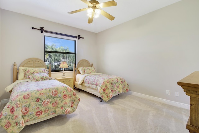 bedroom with light colored carpet and ceiling fan