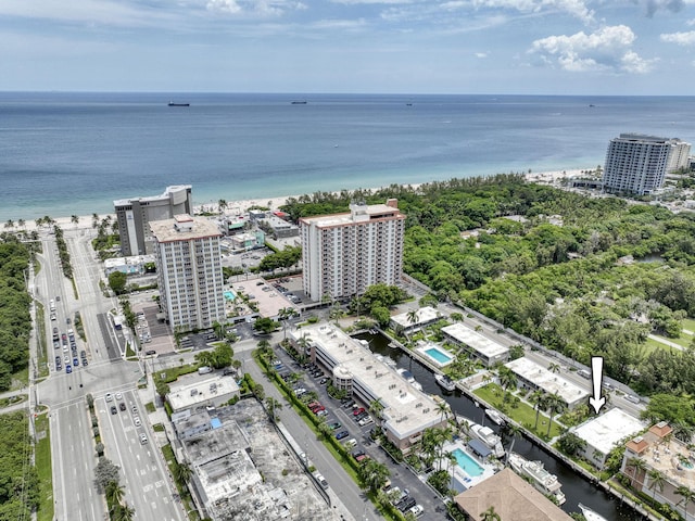 drone / aerial view featuring a view of city and a water view