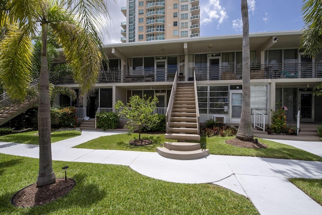 view of property featuring stairway