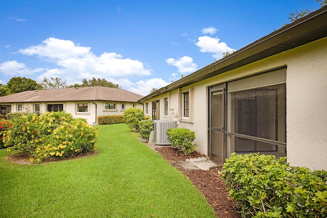 view of yard featuring central AC