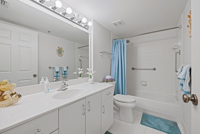 full bathroom featuring toilet, vanity, shower / tub combo, and tile patterned floors