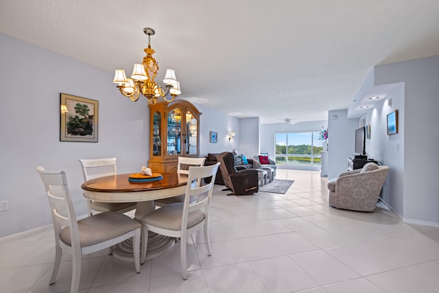 dining space featuring a chandelier and light tile patterned floors