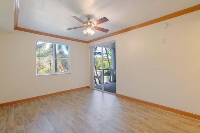 empty room with crown molding, ceiling fan, and light wood-type flooring