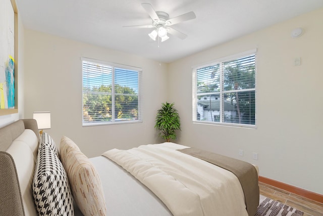 bedroom with hardwood / wood-style flooring and ceiling fan