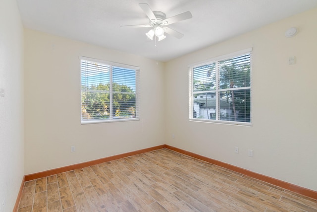 empty room featuring ceiling fan and light wood-type flooring