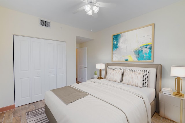 bedroom featuring ceiling fan and a closet