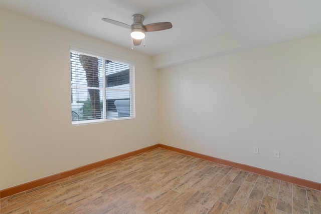 empty room featuring light hardwood / wood-style flooring and ceiling fan