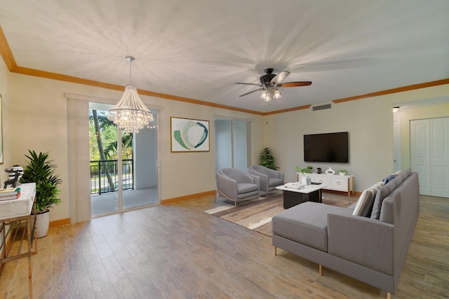 living room with crown molding, ceiling fan with notable chandelier, and hardwood / wood-style floors