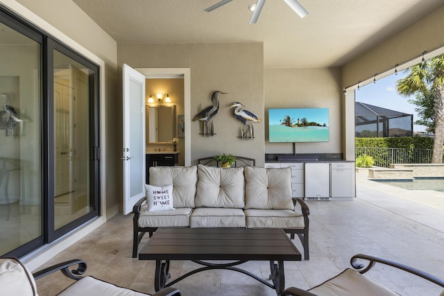 view of patio / terrace with ceiling fan and a lanai