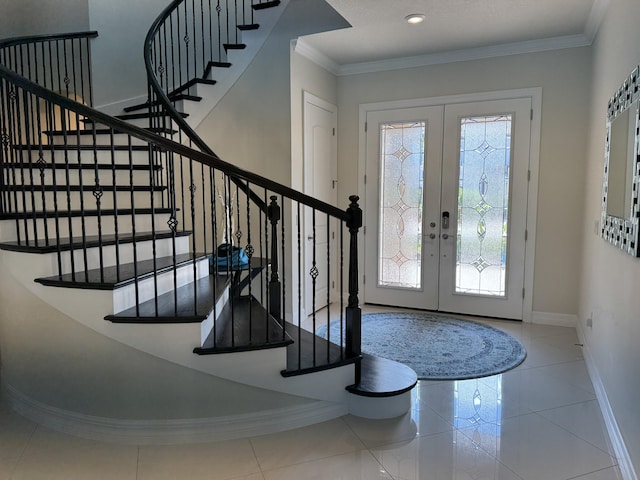 entryway with tile patterned floors, french doors, and ornamental molding