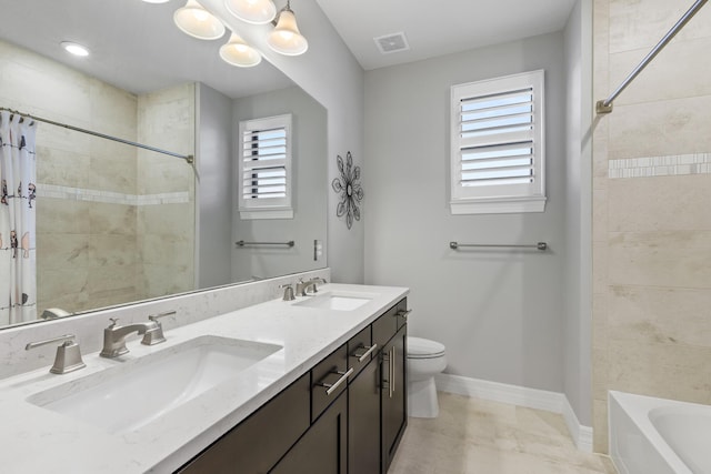 full bathroom featuring a wealth of natural light, shower / bath combo with shower curtain, vanity, and toilet