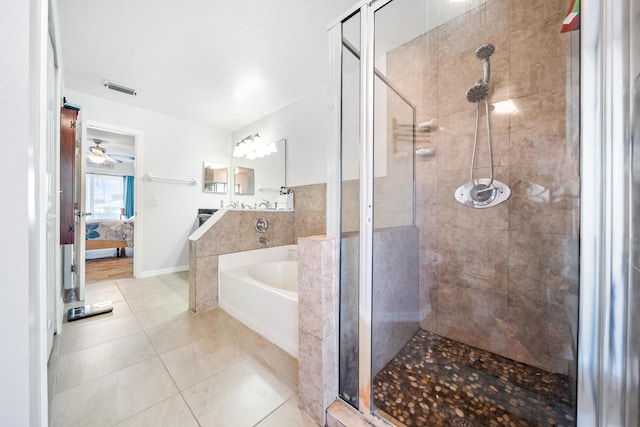 bathroom with ceiling fan, tile patterned flooring, and separate shower and tub