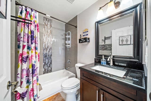 full bathroom featuring vanity, shower / bath combo with shower curtain, tile patterned floors, a textured ceiling, and toilet