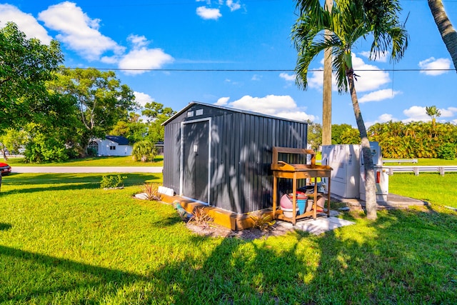 view of outbuilding with a lawn