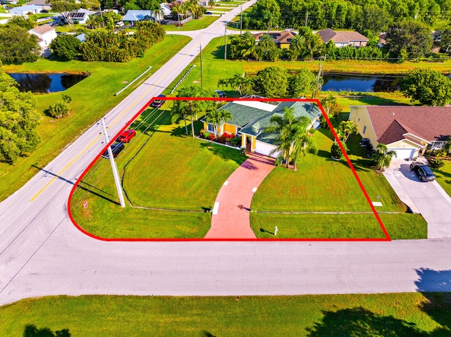 birds eye view of property featuring a water view