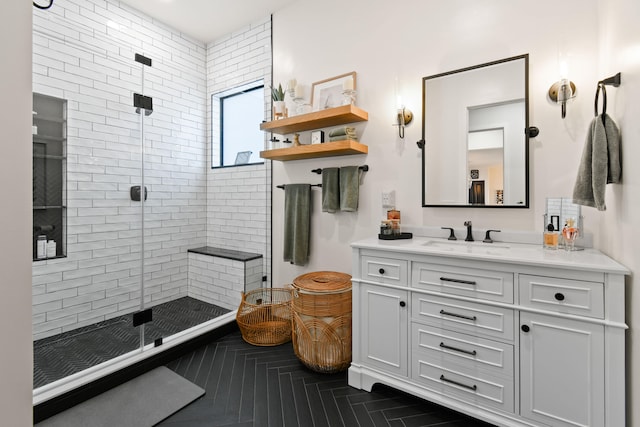 bathroom featuring an enclosed shower and vanity