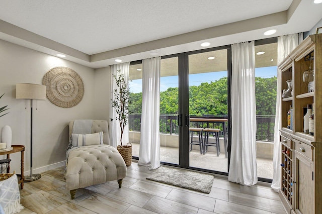 interior space featuring a textured ceiling and french doors