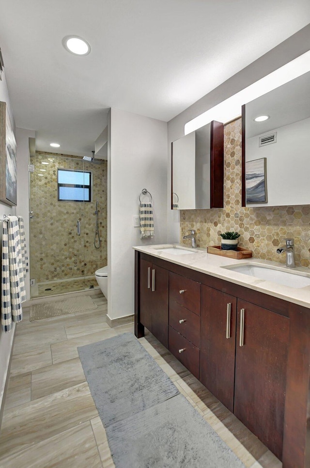 bathroom featuring wood-type flooring, walk in shower, vanity, and toilet