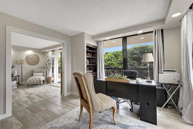 office space featuring a textured ceiling